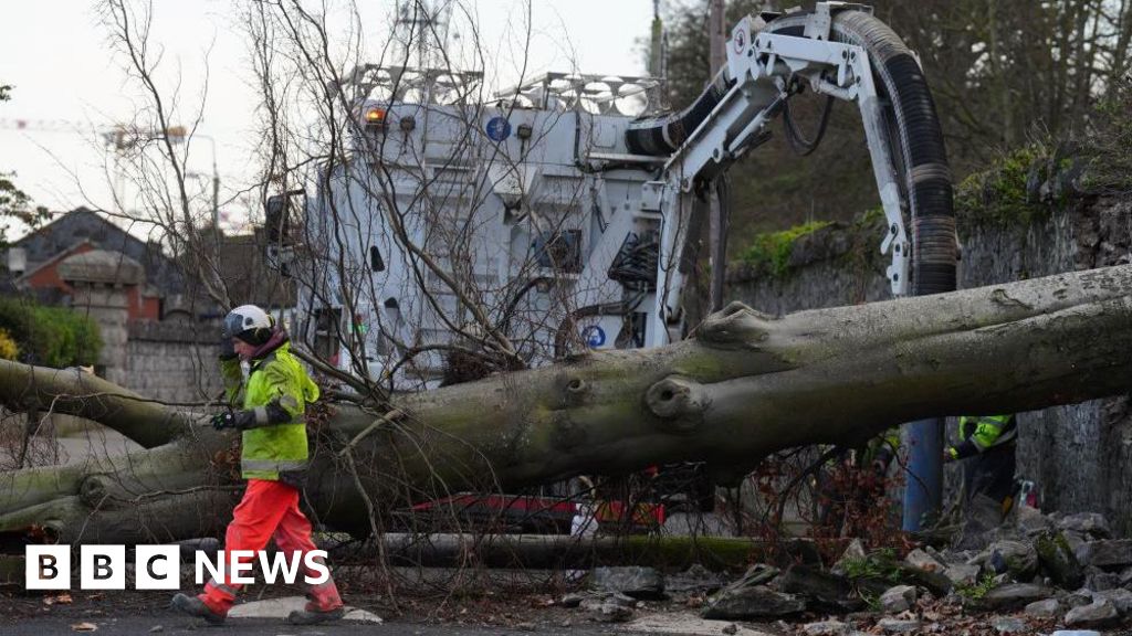 High winds continue as nearly a million without power