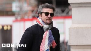 Joey Barton kicked wife in head in row, court hears