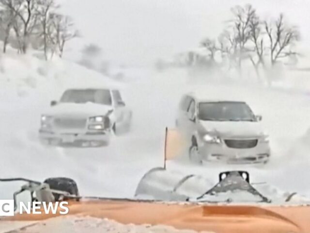 Snowplough used on cars stranded in blizzard conditions
